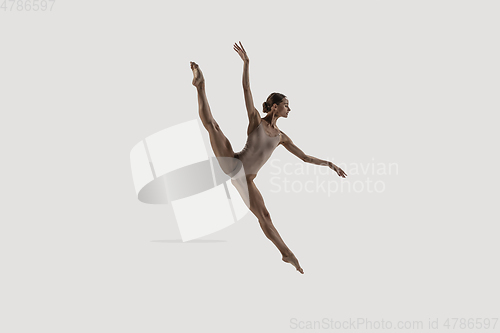 Image of Modern ballet dancer. Contemporary art ballet. Young flexible athletic woman.