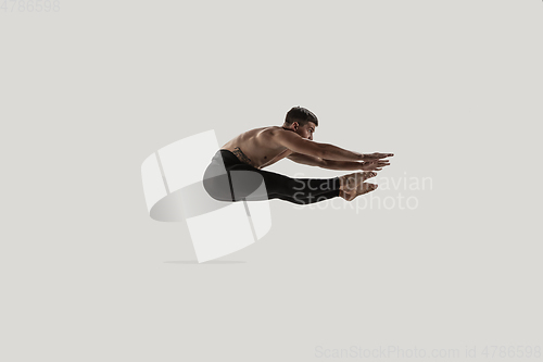 Image of Modern ballet dancer. Contemporary art ballet. Young flexible athletic man.