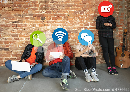 Image of Creative millenial people connecting and sharing social media. Modern UI icons as heads