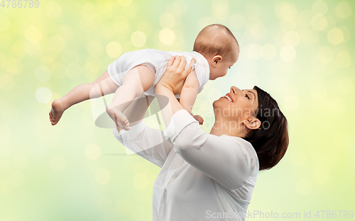 Image of happy middle-aged mother with little baby daughter