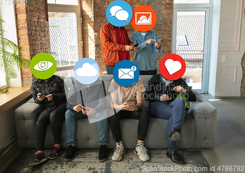 Image of Creative millenial people connecting and sharing social media. Modern UI icons as heads