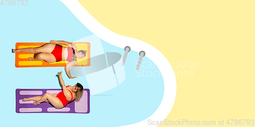 Image of Top view of young caucasian model\'s resting on beach resort