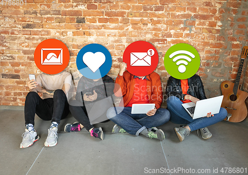 Image of Creative millenial people connecting and sharing social media. Modern UI icons as heads