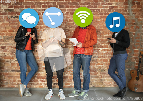 Image of Creative millenial people connecting and sharing social media. Modern UI icons as heads