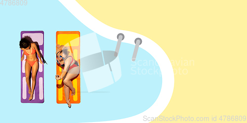 Image of Top view of young caucasian model\'s resting on beach resort