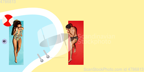 Image of Top view of young caucasian model\'s resting on beach resort