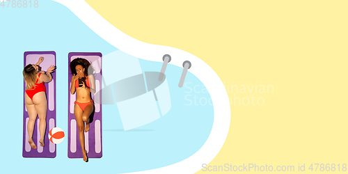 Image of Top view of young caucasian model\'s resting on beach resort