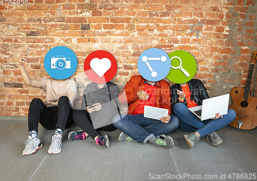 Image of Creative millenial people connecting and sharing social media. Modern UI icons as heads