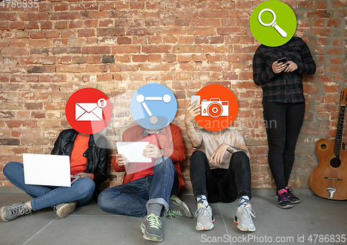 Image of Creative millenial people connecting and sharing social media. Modern UI icons as heads