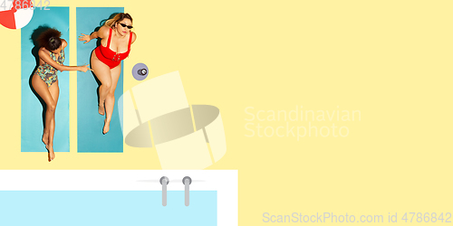 Image of Top view of young caucasian model\'s resting on beach resort