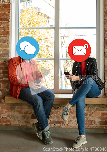 Image of Creative millenial people connecting and sharing social media. Modern UI icons as heads