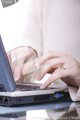 Image of Typing on a laptop