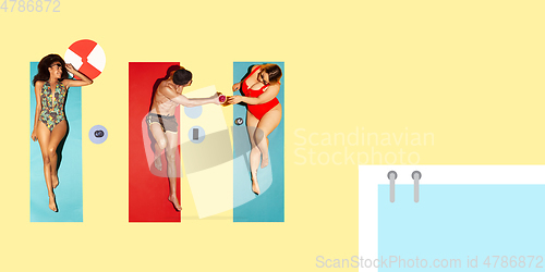 Image of Top view of young caucasian model\'s resting on beach resort