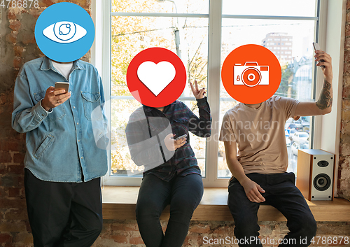 Image of Creative millenial people connecting and sharing social media. Modern UI icons as heads