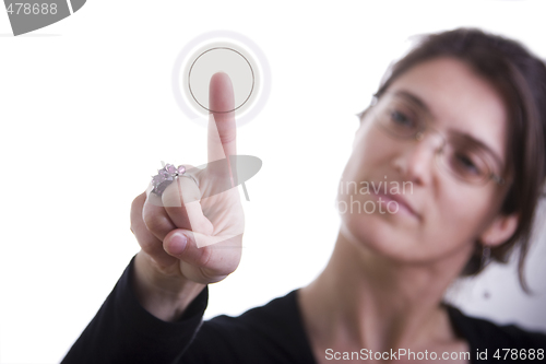 Image of businesswoman pressing a button