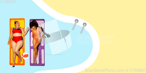 Image of Top view of young caucasian model\'s resting on beach resort