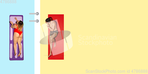 Image of Top view of young caucasian model\'s resting on beach resort