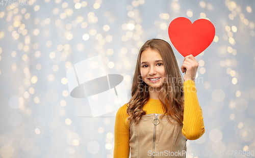 Image of smiling teenage girl with red heart