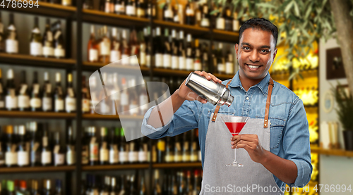Image of indian barman with glass of cocktail and shaker