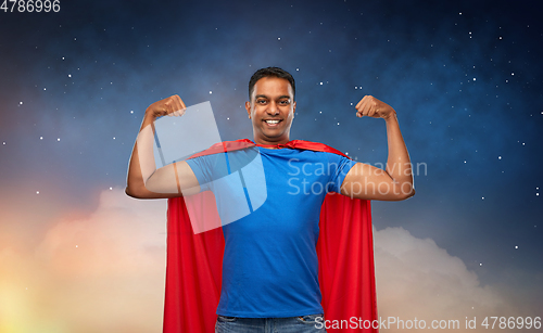 Image of indian man in superhero cape showing his power