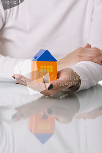 Image of businesswoman selling a house