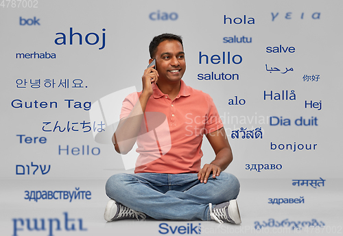 Image of happy indian man calling on smartphone