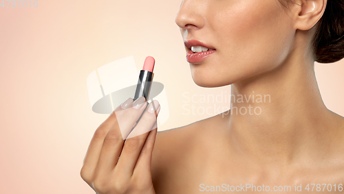 Image of beautiful smiling young woman with pink lipstick