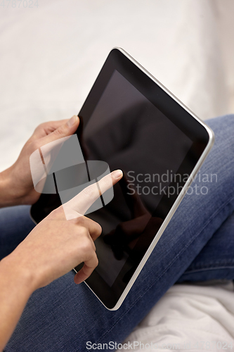 Image of close up of young woman with tablet computer