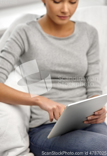 Image of close up of young woman with tablet computer