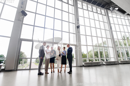 Image of business people with tablet pc computer at office