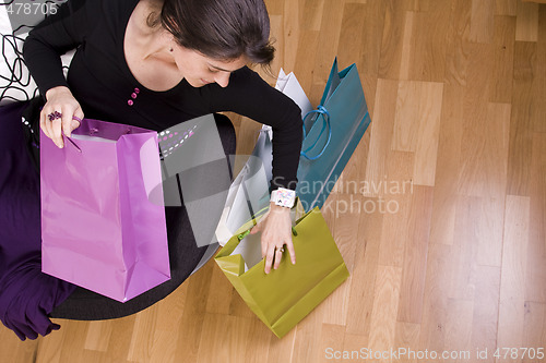 Image of woman showing her shopping bags