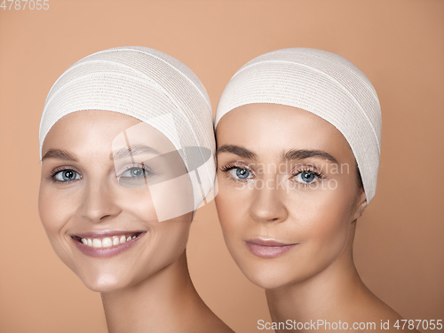 Image of Portrait of beautiful young women isolated on brown studio background