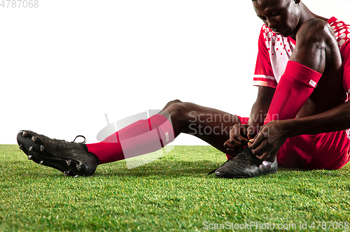 Image of Professional african football or soccer player isolated on white background