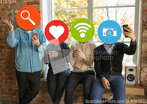 Image of Creative millenial people connecting and sharing social media. Modern UI icons as heads