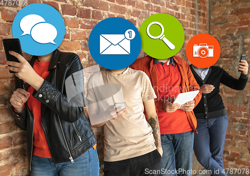 Image of Creative millenial people connecting and sharing social media. Modern UI icons as heads