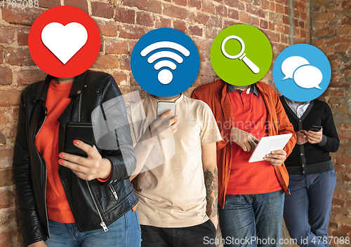 Image of Creative millenial people connecting and sharing social media. Modern UI icons as heads