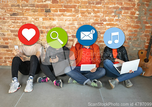 Image of Creative millenial people connecting and sharing social media. Modern UI icons as heads