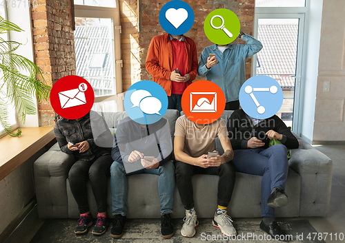 Image of Creative millenial people connecting and sharing social media. Modern UI icons as heads