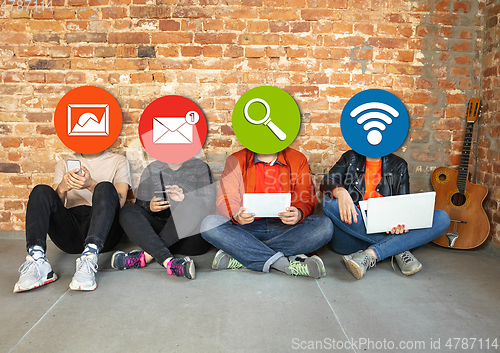 Image of Creative millenial people connecting and sharing social media. Modern UI icons as heads