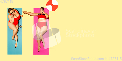 Image of Top view of young caucasian model\'s resting on beach resort