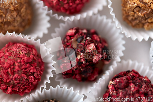 Image of close up of different candies in paper cups