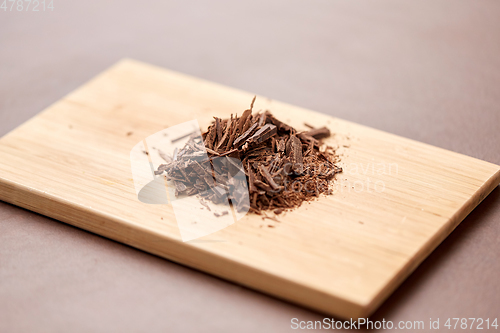 Image of chocolate chips on wooden board