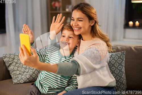 Image of mother and son with smartphone having video call