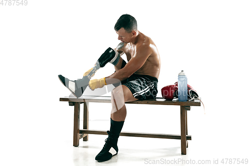 Image of Full length portrait of muscular sportsman with prosthetic leg, copy space. Male boxer in red gloves.