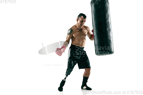 Image of Full length portrait of muscular sportsman with prosthetic leg, copy space. Male boxer in red gloves.