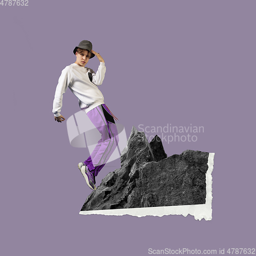 Image of Modern design, contemporary art collage. Inspiration, idea, trendy urban magazine style. Young man standing on mountains on pastel purple background