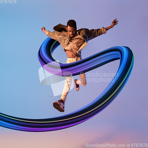 Image of Stylish man with long fluid flood on gradient background. Negative space to insert your text. Modern design. Contemporary colorful and conceptual bright art collage.