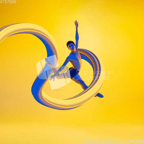 Image of Fit ballet dancer with long fluid flood on gradient background. Negative space to insert your text. Modern design. Contemporary colorful and conceptual bright art collage.