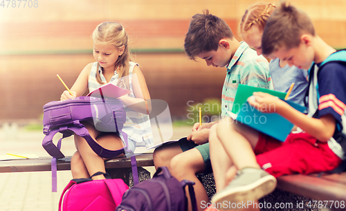 Image of group of happy elementary school students outdoors