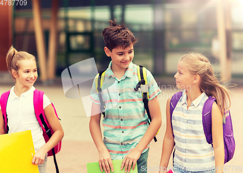 Image of group of happy elementary school students walking